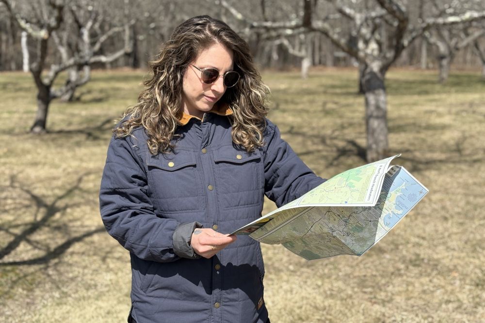 Bringing Landscape Architecture Directly to Communities Stephanie Stroud '12 in the field with a map