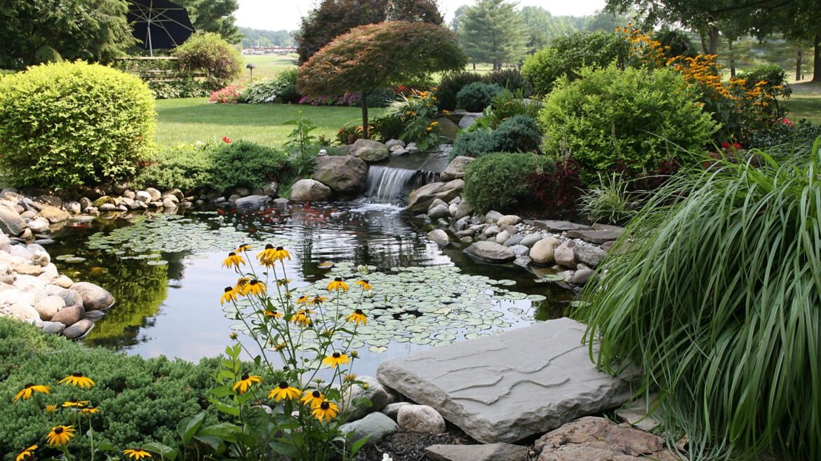 Earth Day Garden Jobs: 6 Quick Ways To Help Nature Pond garden with flowers and grass beyond