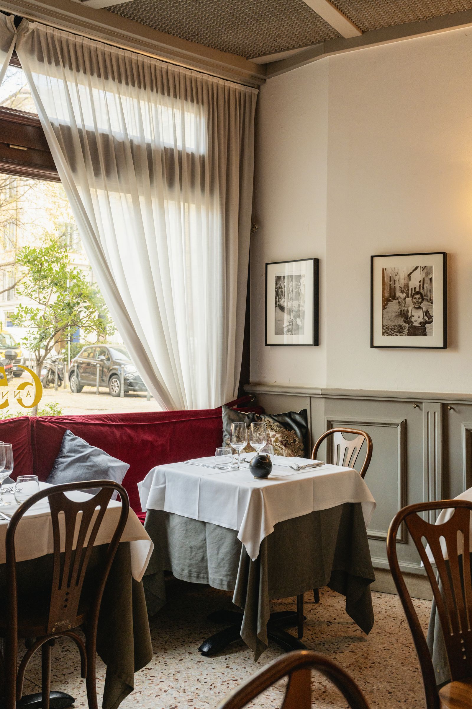 Image may contain Architecture Building Dining Room Dining Table Furniture Indoors Room Table Tablecloth and Art