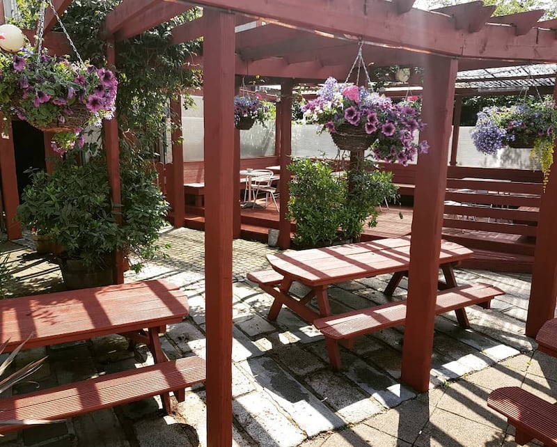 Sun shining in the beer garden at Belfast's INF, where Pint Tracker is currently reporting the cheapest pint in the city
