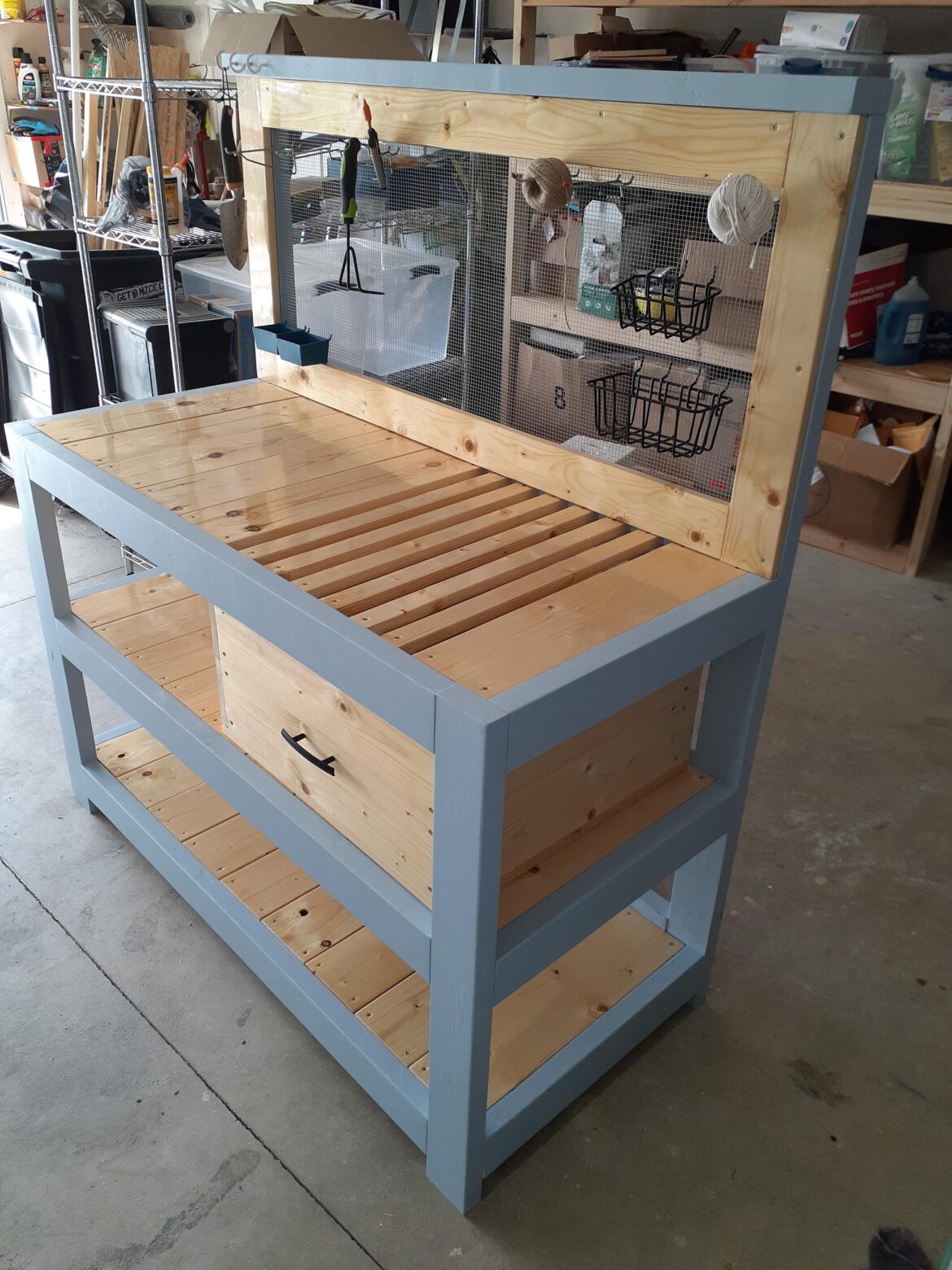 My husband built me a potting bench!