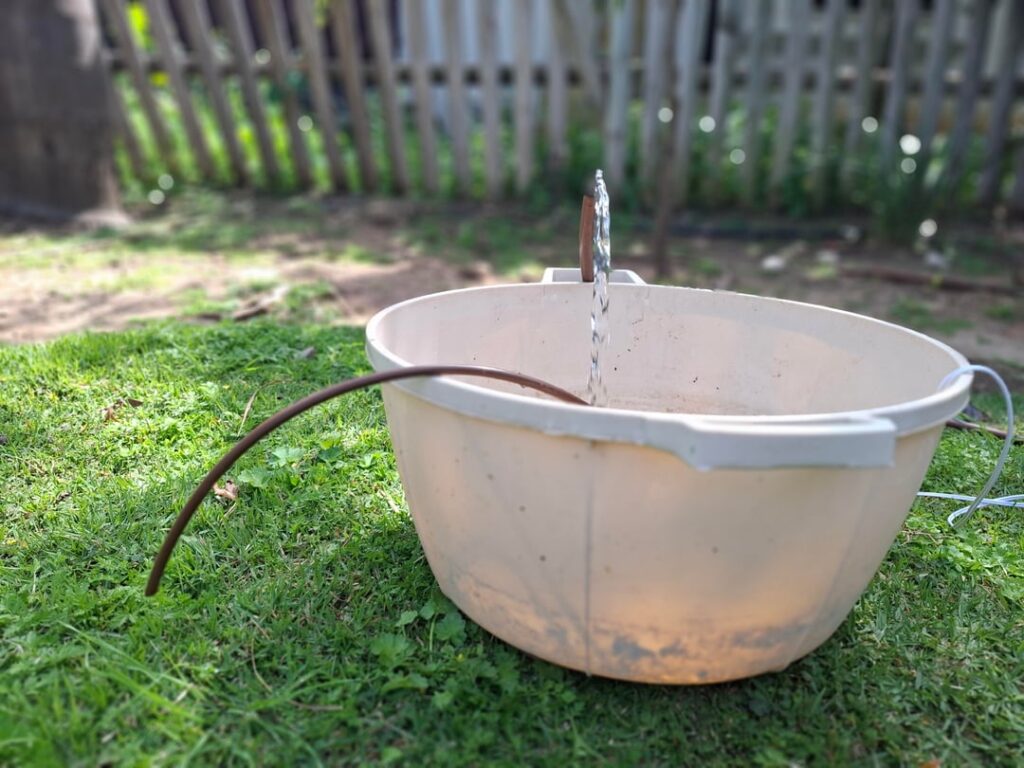 No-chemical mosquito trap I built for our garden pool - auto-flushes every 4 days to break the breeding cycle. $35 in parts, three weeks in the yard is finally livable