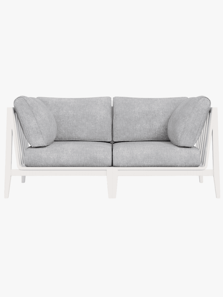 White outdoor sofa with gray pillows 