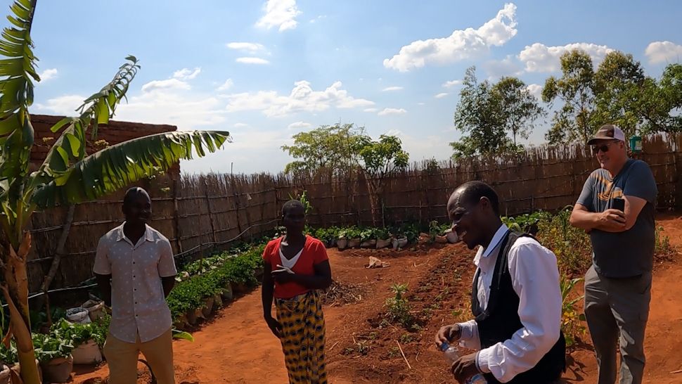 Harry Dalke at a garden with the Well of Plenty project