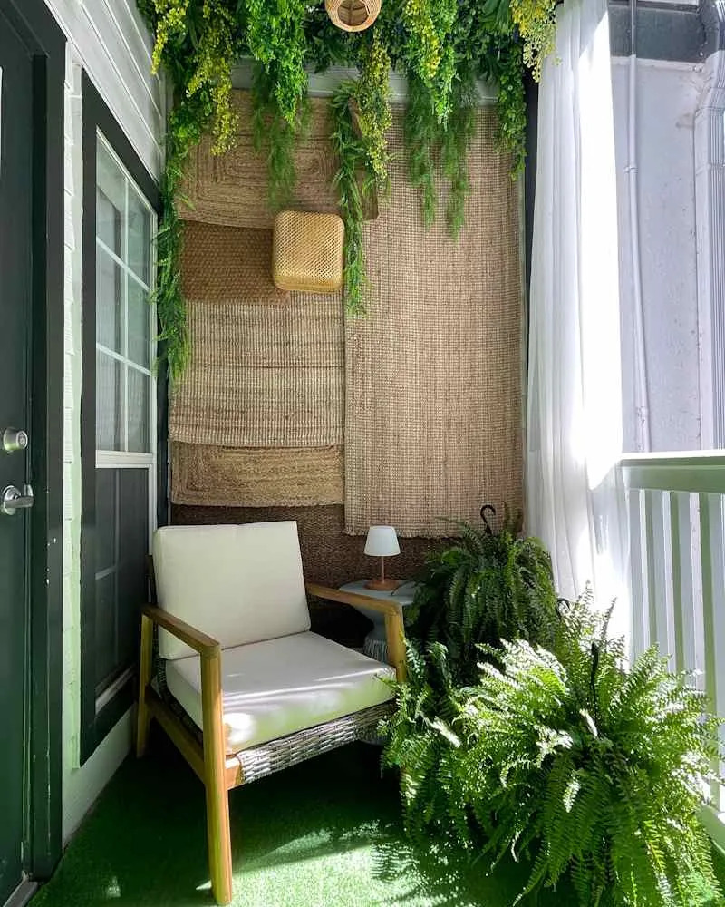 Arm chair in front of grass rug installation on  newly renovated patio.