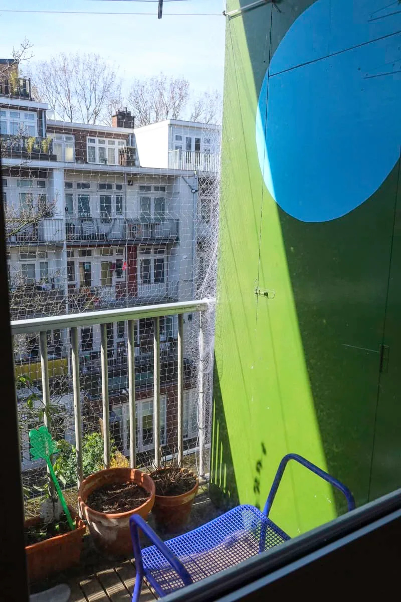 outdoor terrace with green and blue paint