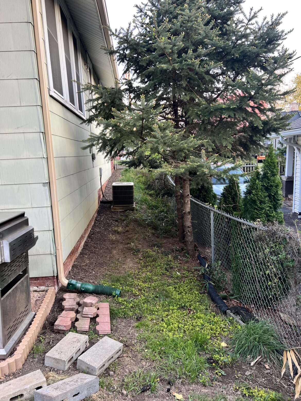 Dry well to prevent water flowing to neighbors property? Dry well to prevent water flowing to neighbors property?