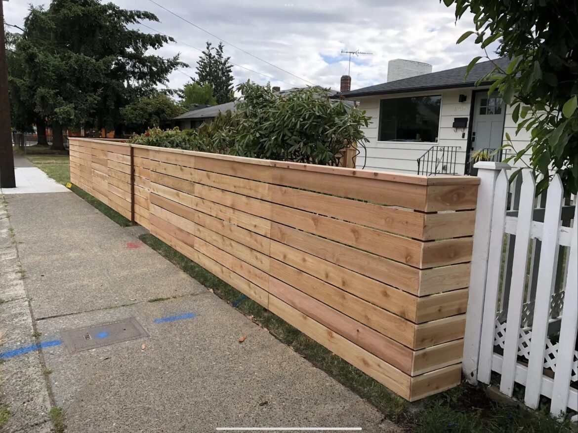 The neighbor's traditional picket fence vs. our new horizontal cedar build. A classic comparison. If you were buying this house, which look are you hoping for?