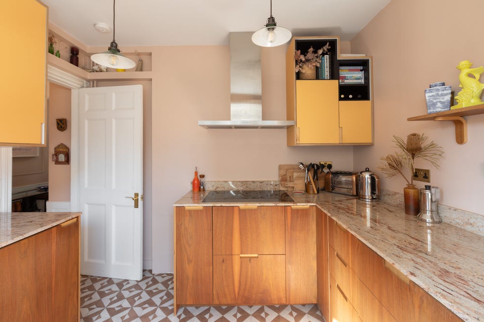 modern kitchen with wooden cabinets and yellow accents