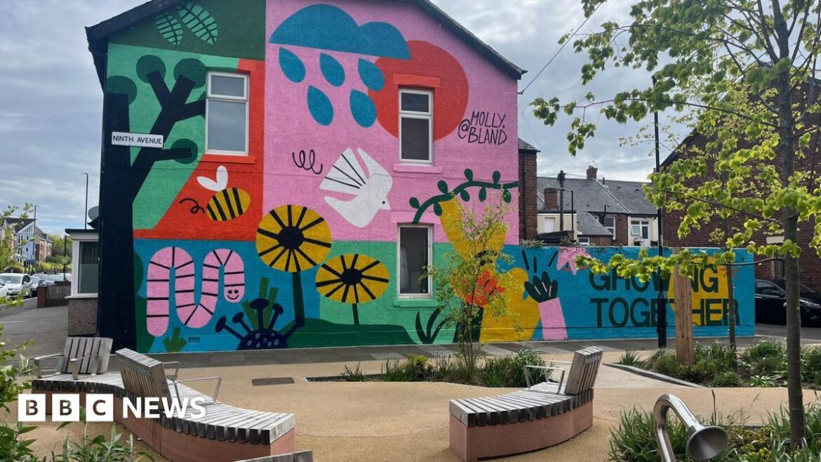 Garden designed with Newcastle school pupils wins award The garden, which was built on an empty plot next to Chillingham Road. It features improved pathways, curved benches, trees, planters for bushes and flowers, insect boxes, and talking tubes - play equipment which allows children to talk to each other at opposite ends of the garden. On the outer wall of a house facing the garden is a brightly coloured mural painted by artist Molly Bland, which features cartoon flowers, insects, and birds. The words "Growing Together" are painted at the bottom.