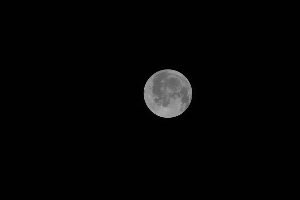 This photo provided by NASA shows the moon seen from a window on the Orion spacecraft Integrity during the Artemis II mission on Friday, April 3, 2026. (NASA via AP)