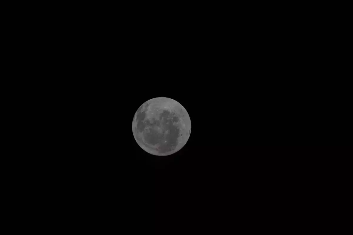 This image provided by NASA shows the moon from a photo taken by The Artemis II crew on day 4 of their journey to the Moon on Saturday, April 4, 2026. (NASA via AP)