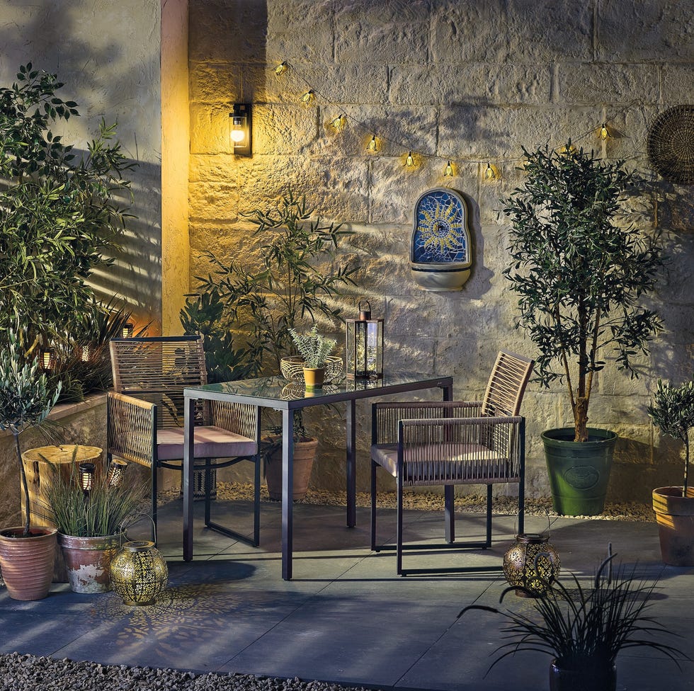 Cosy outdoor seating area with plants and decorative elements cosy outdoor seating area with plants and decorative elements