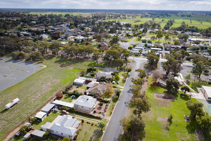 A country Victorian town with fields in the distance. 