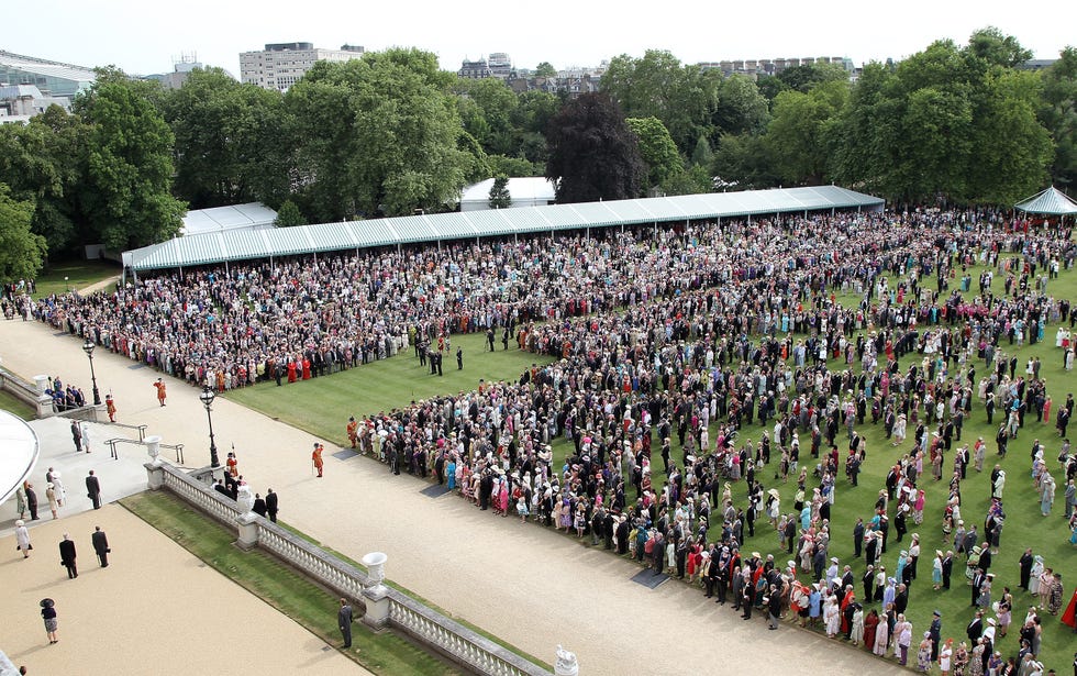 The Queen Hosts A Garden Party At Buckingham Palace london, england july 20: guests sing god save the queen in the gardens of buckingham palace during a garden party hosted by the queen on july 20, 2010 in london, england. (photo by chris jackson wpa pool/getty images)