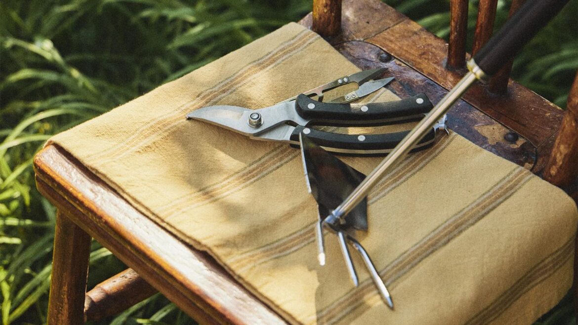 Zara Home’s Gardening Collection is Here: Shop Our Edit Shears and a hand rake on a taupe cloth draped across a wooden chair in a garden