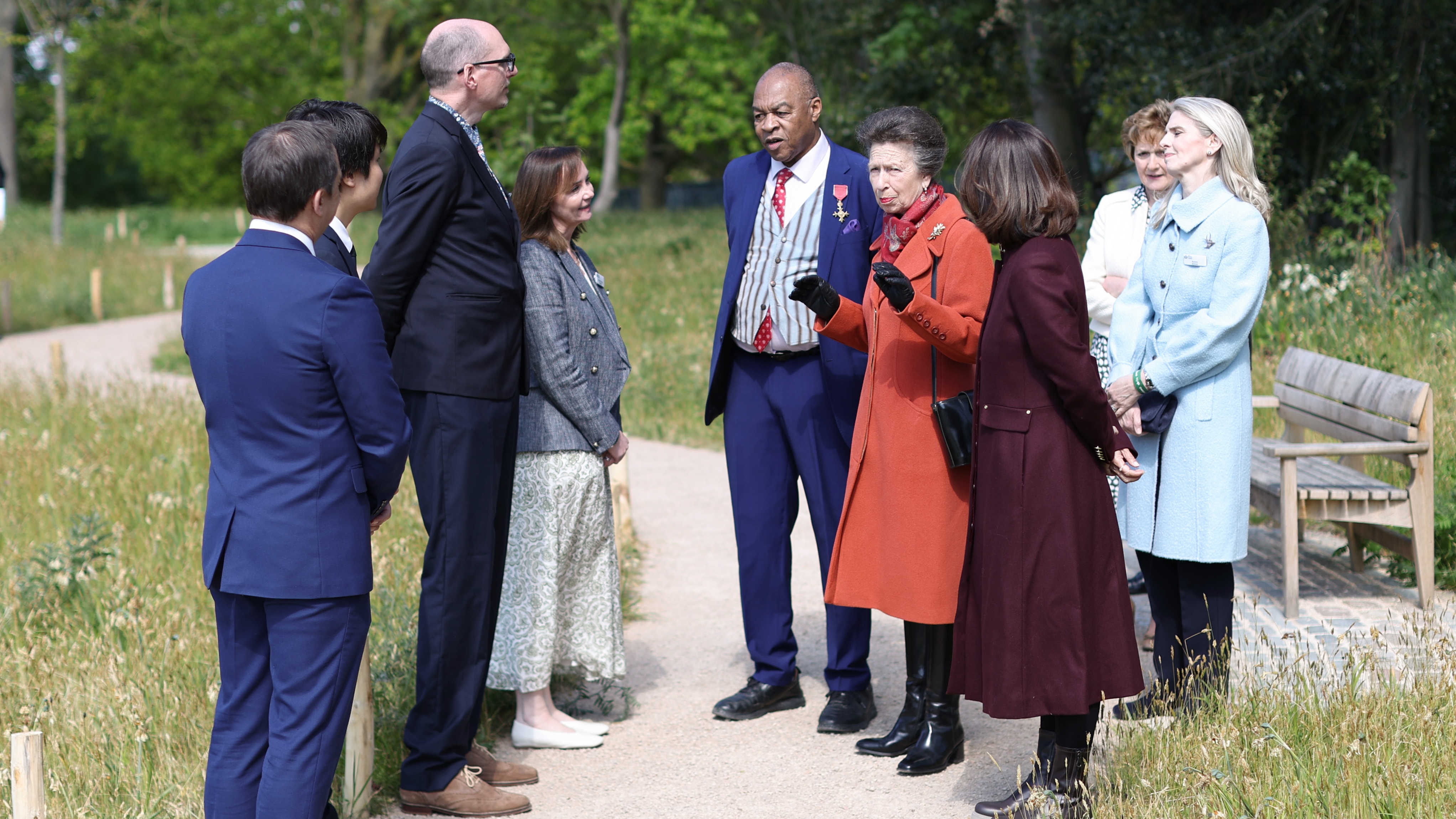 Princess Anne speaks with members of the gardening team during the official opening of The Queen Elizabeth II Garden on April 21, 2026