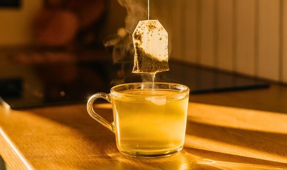 Picture of someone brewing tea Picture of someone brewing tea