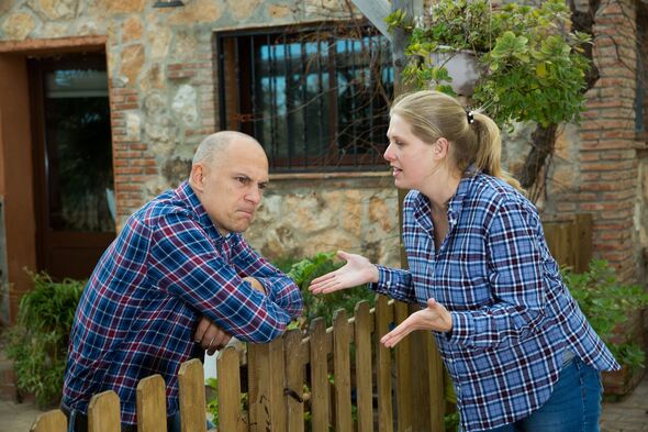 Spouses quarreling in backyard Spouses quarreling in backyard
