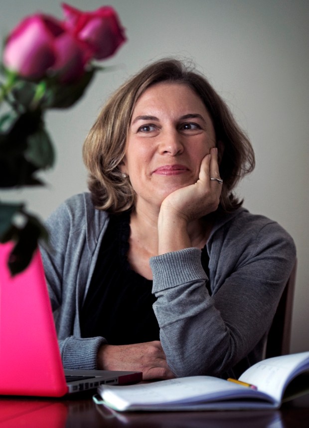 Karen Zacarias works at her favorite spot in the townhouse she shares with four other playwrights participating in the American Voices New Play Institute at Arena Stage, on September, 21, 2011 in Washington, D.C. (Photo by Bill O'Leary/The Washington Post via Getty Images)