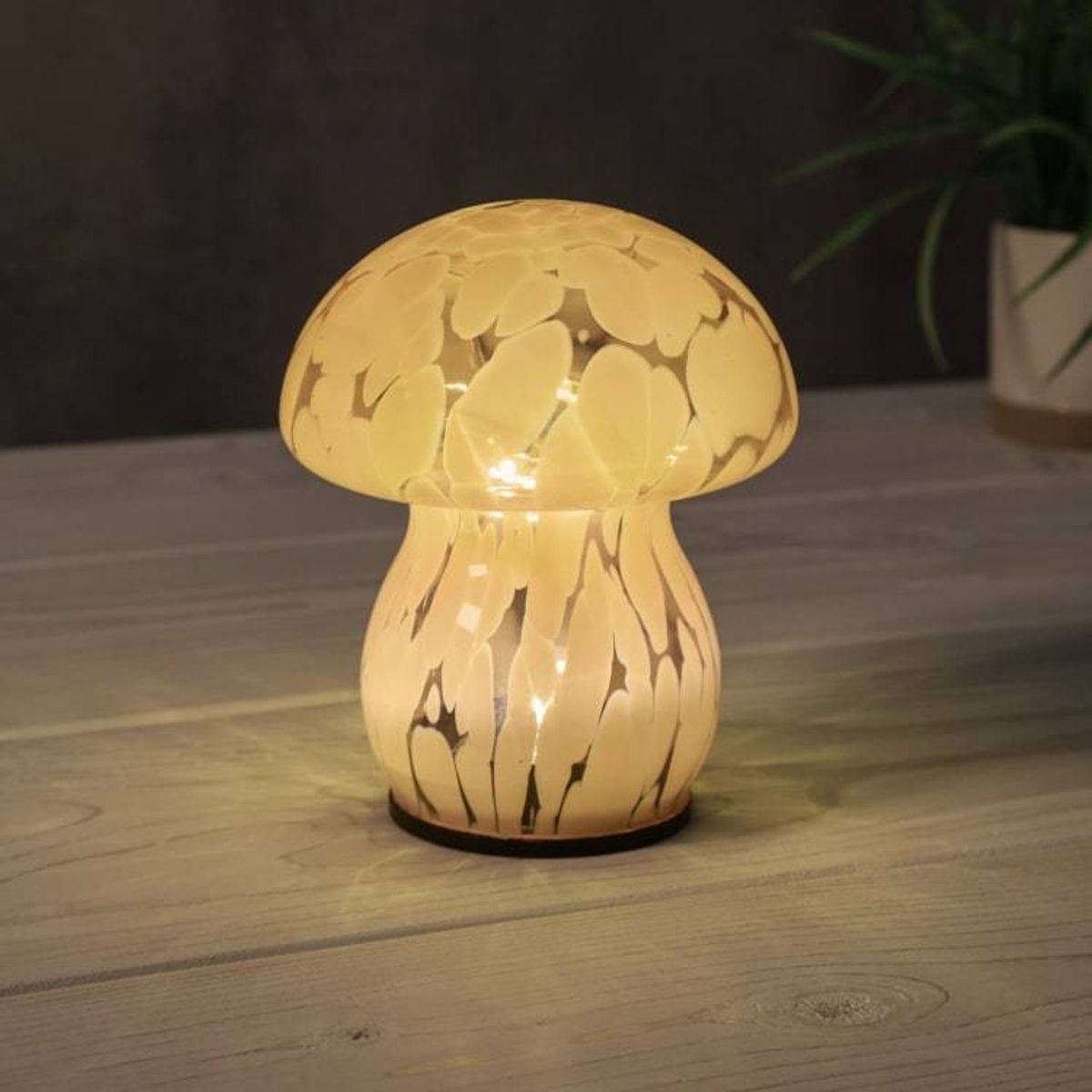 The solar-powered, glass lamp is also available in white