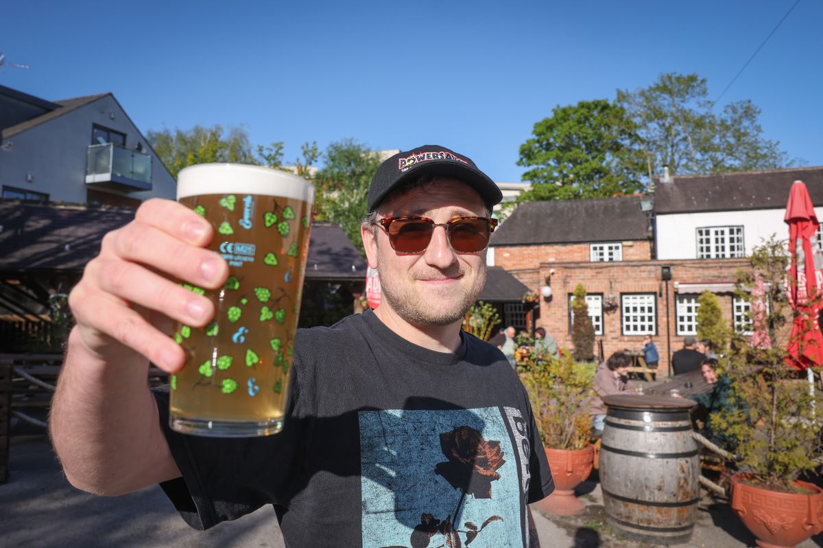 Owen Williams with a pint in the beer garden at the Crown in Beeston