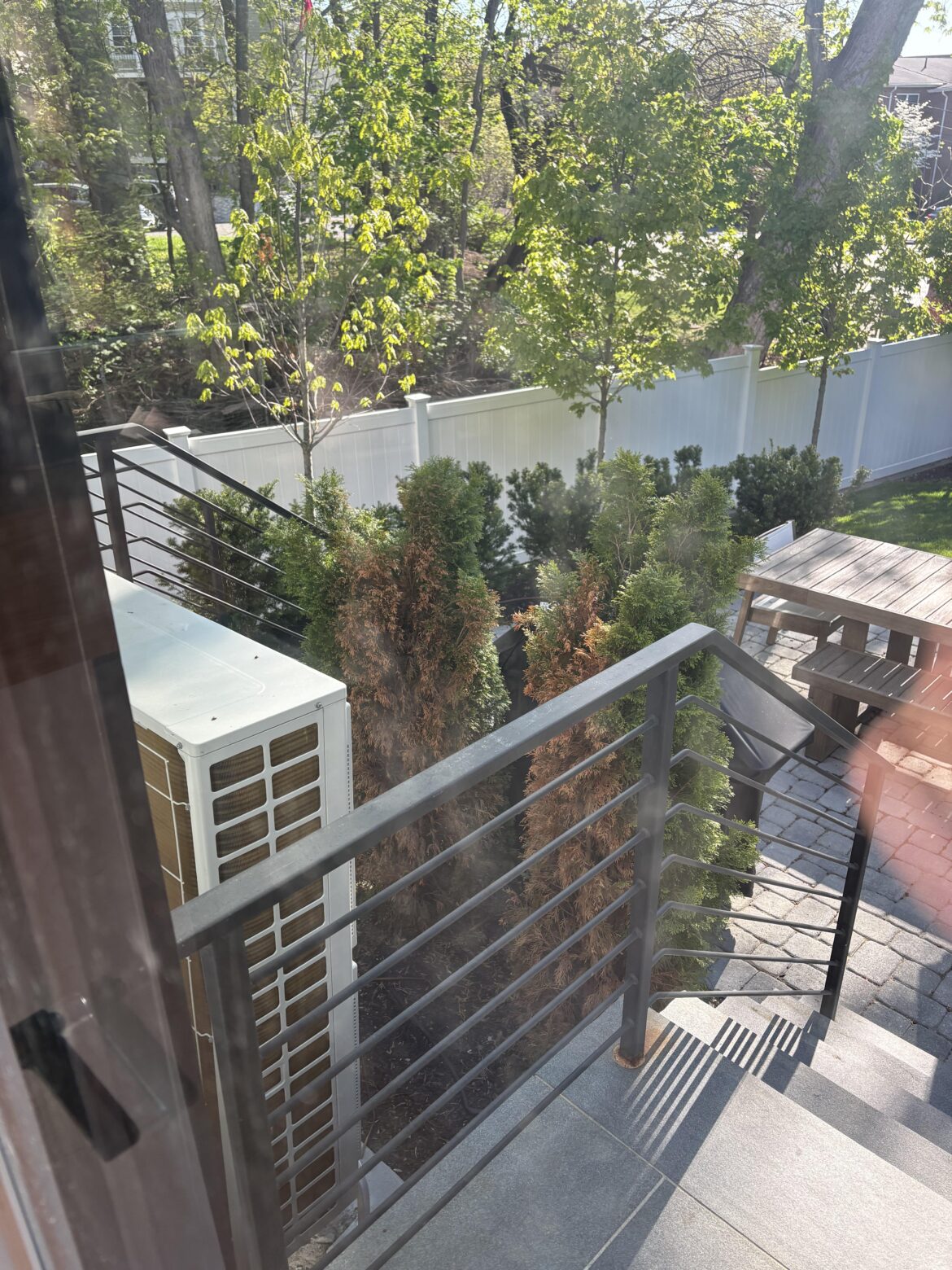 Heat pump blows directly on bushes
