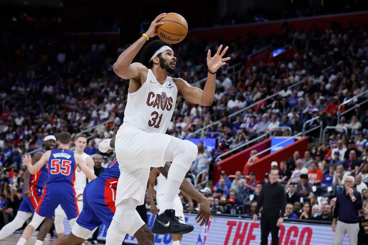 Cleveland Cavaliers center Jarrett Allen (31) goes to the basket against Detroit Pistons during the second half of Game 7 in a second-round NBA basketball playoffs series Sunday, May 17, 2026, in Detroit. (AP Photo/Duane Burleson)