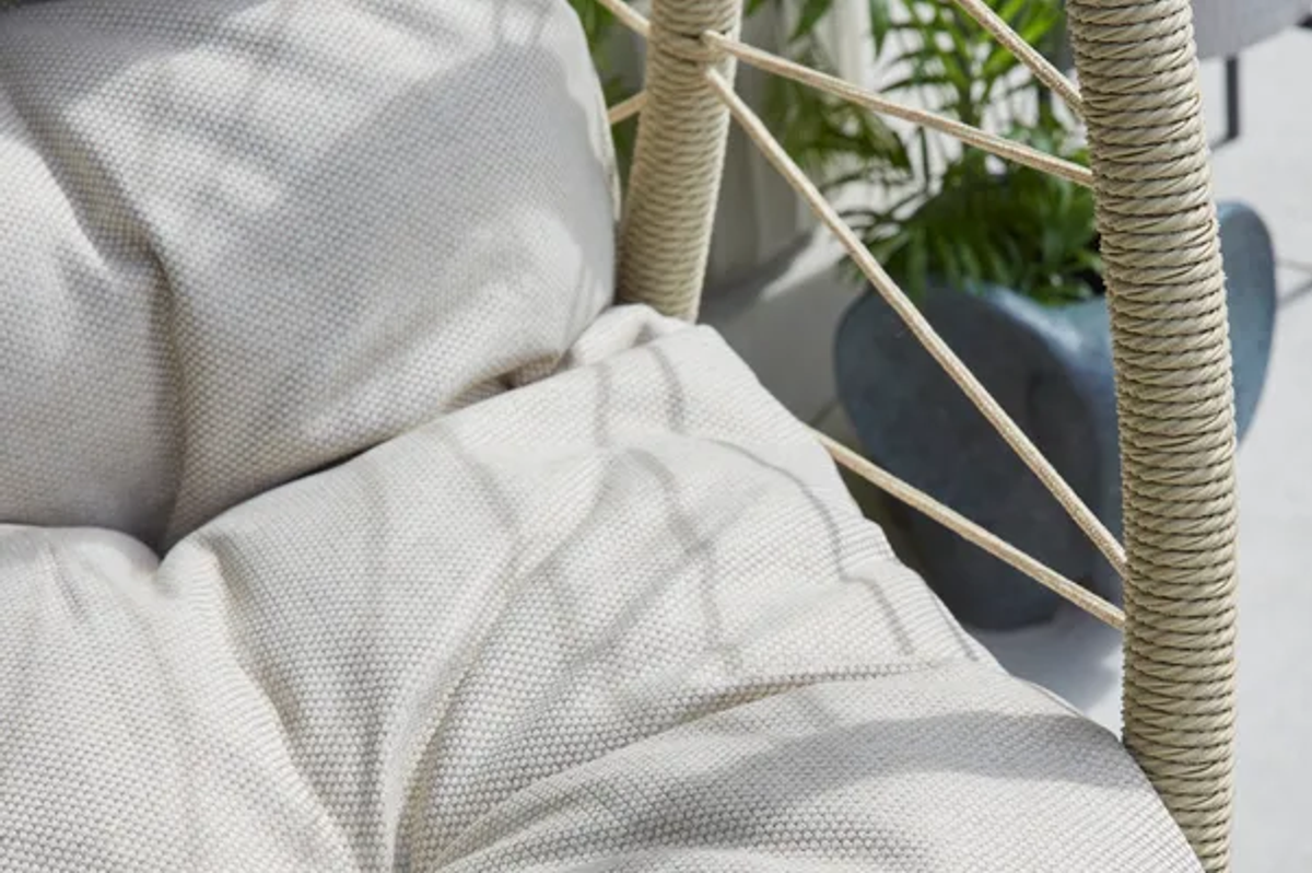 The cosy chair comes with plush cushions ideal for curling up on