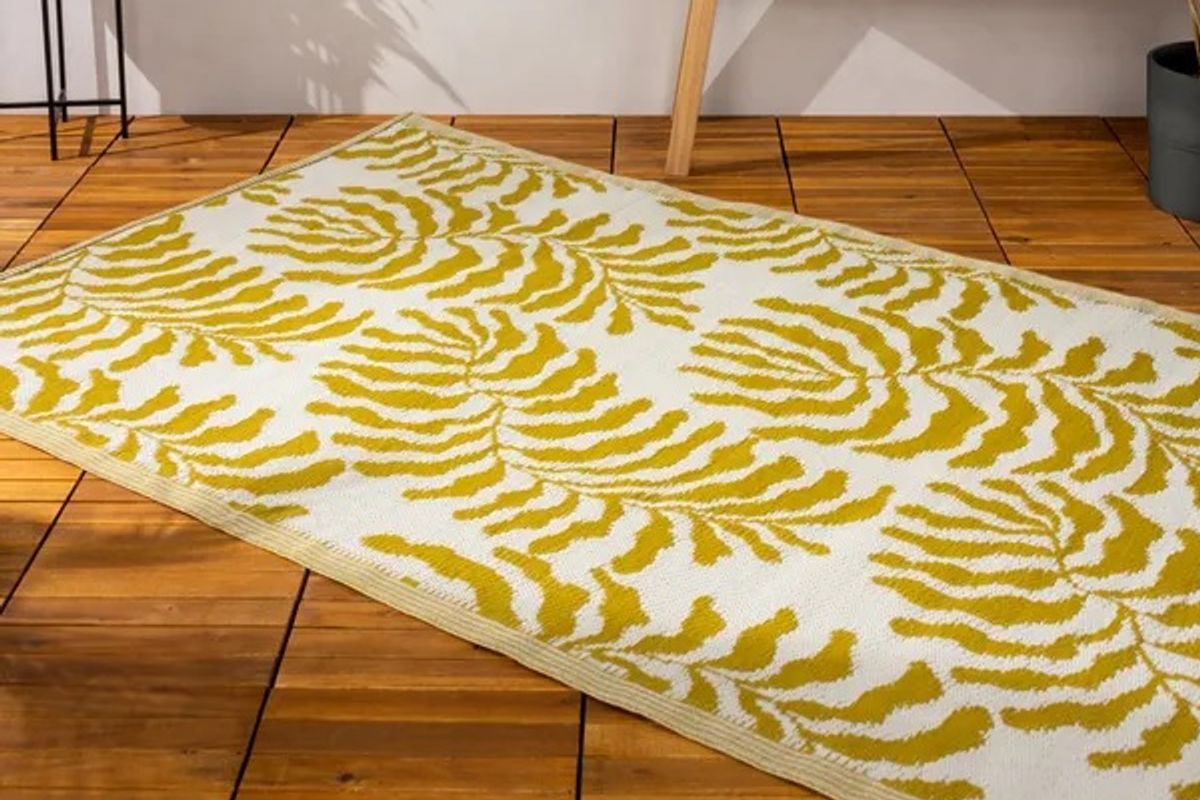 The furn. Tocorico Mustard Reversible Indoor Outdoor Rug