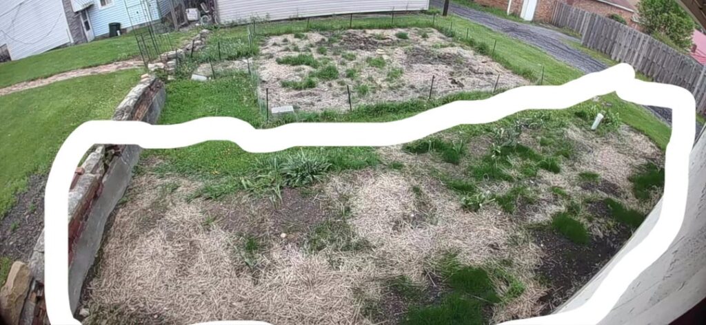 Slopped away from garage and rebuild lawn and possible power bed?