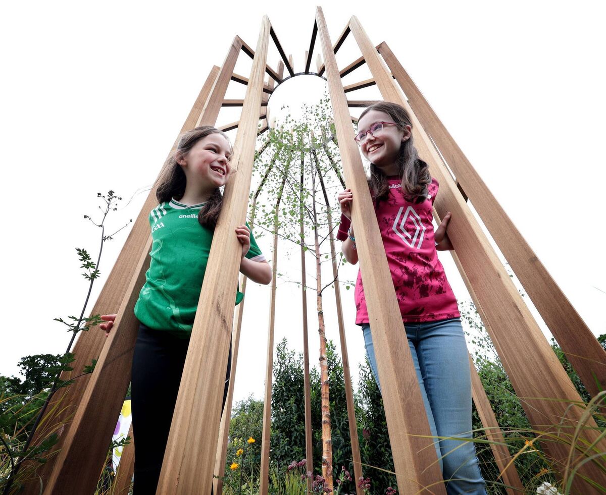 Future Farmers competition winners at Bloom 2025 Trish Halpin, from Knocklong NS, Co Limerick, and Emily Lambes, from St Patrick's NS, Ballinagore, Co Westmeath, pictured at the National Dairy Council garden entitled 'The Grass Advantage', designed by Robert Moore. Picture: Robbie Reynolds