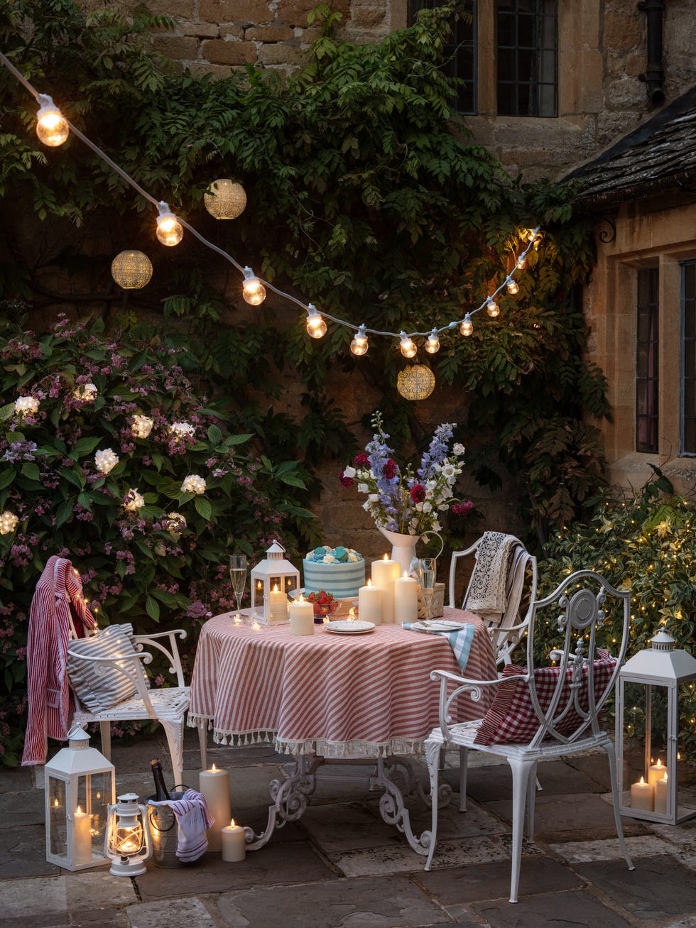 outdoor dining setup with decorative lighting outdoor dining setup with decorative lighting