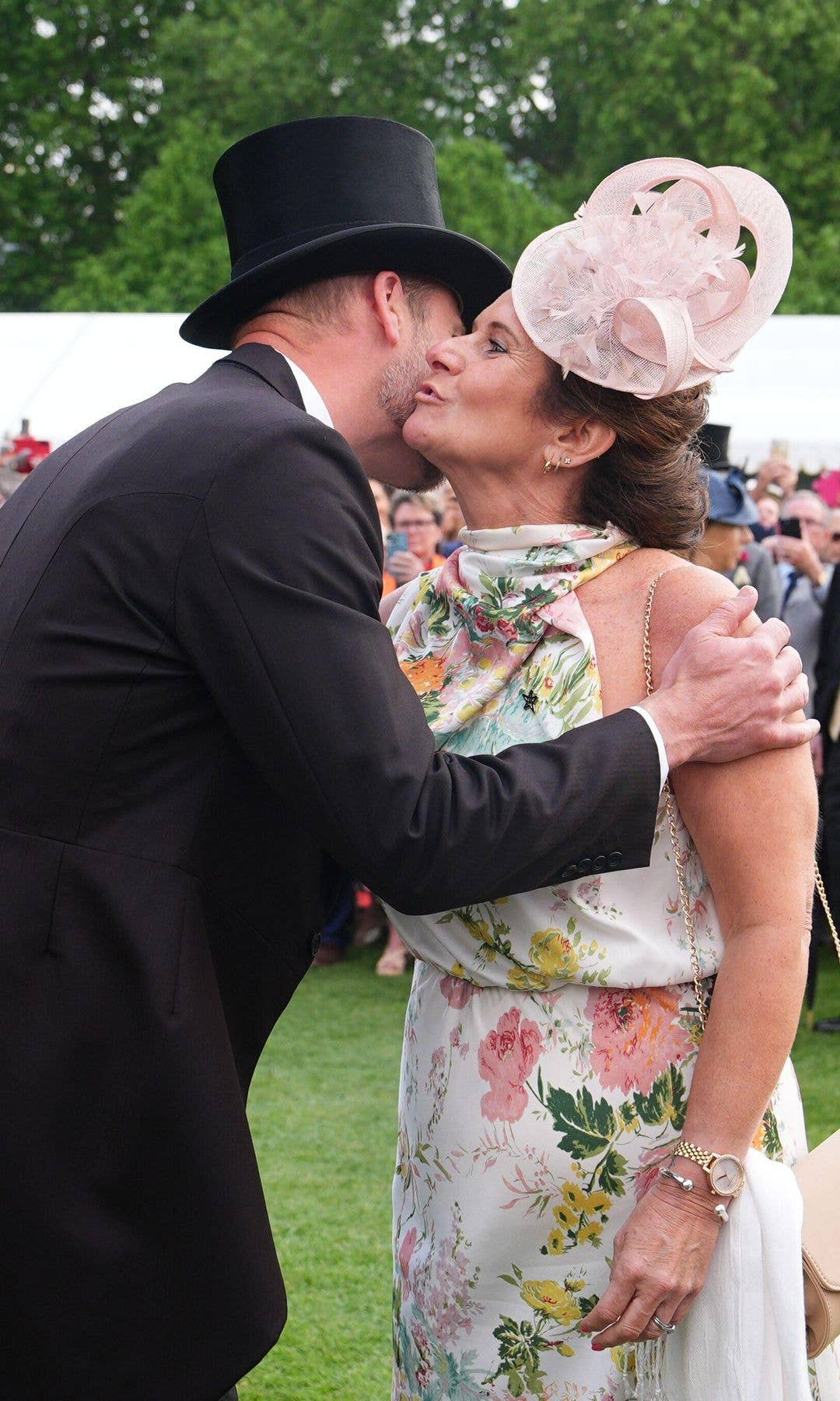 Prince William kissing a woman on the cheek