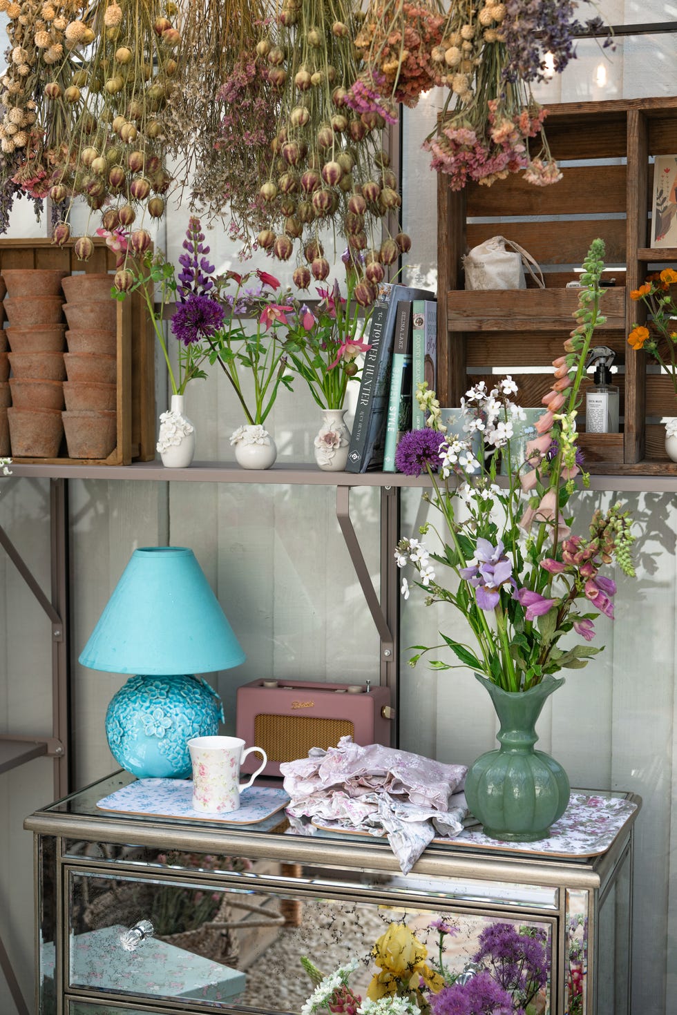 Colorful floral display with decorative items.