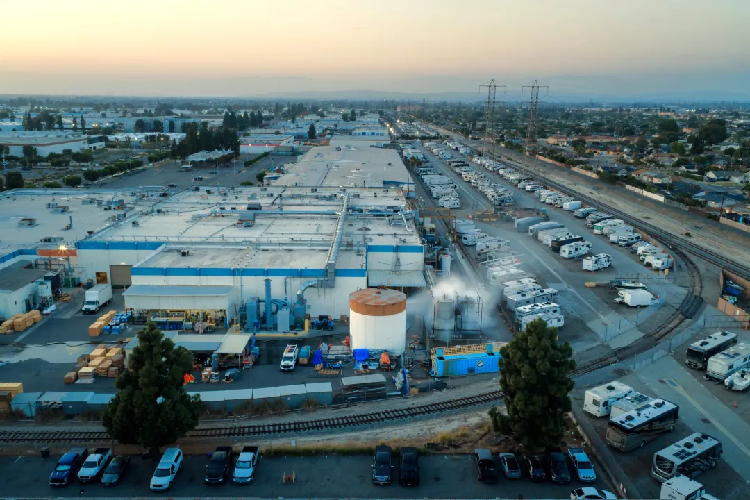 Water is sprayed on a tank that overheated at an aerospace plant in Garden Grove, Calif., Friday, May 22, 2026. (AP Photo/Ethan Swope)