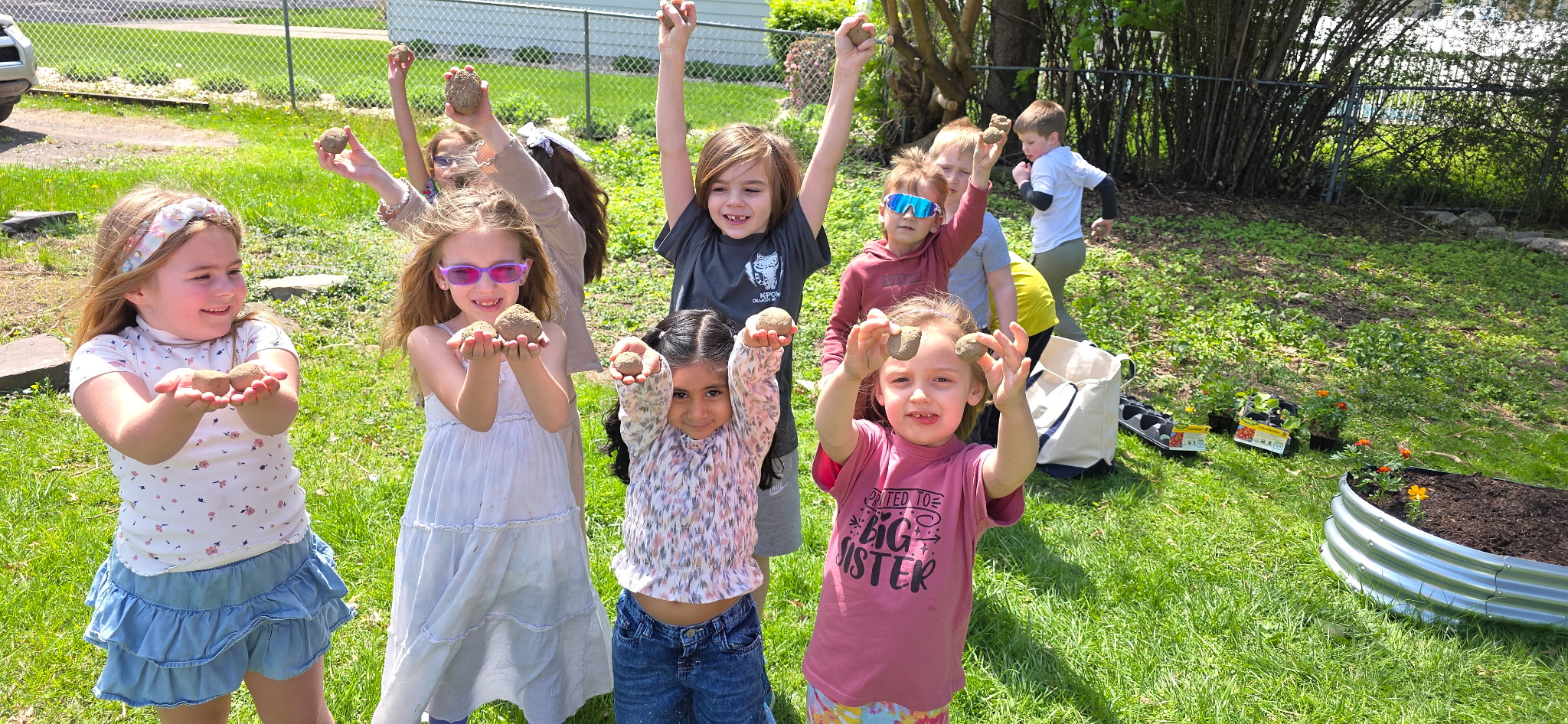 Jenny Lynn students work with Jayanne Czerniakowski on their school...
