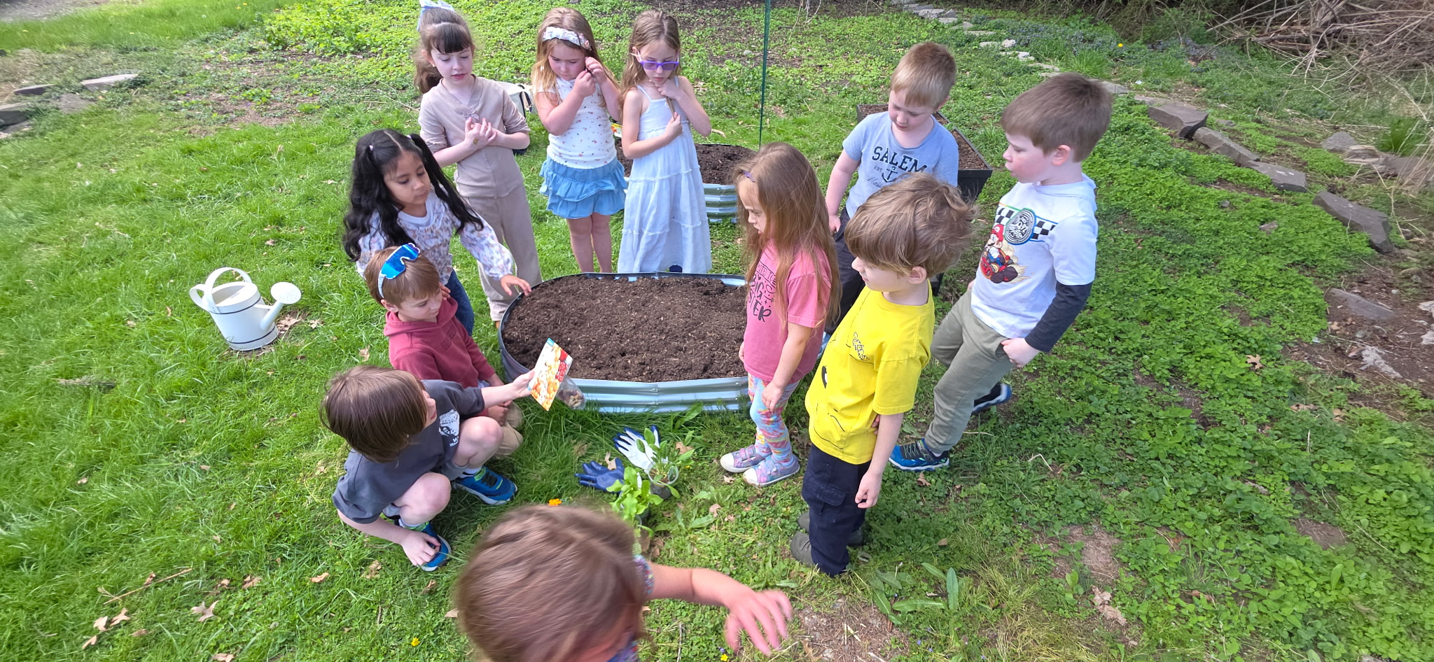 Jenny Lynn students work with Jayanne Czerniakowski on their school...
