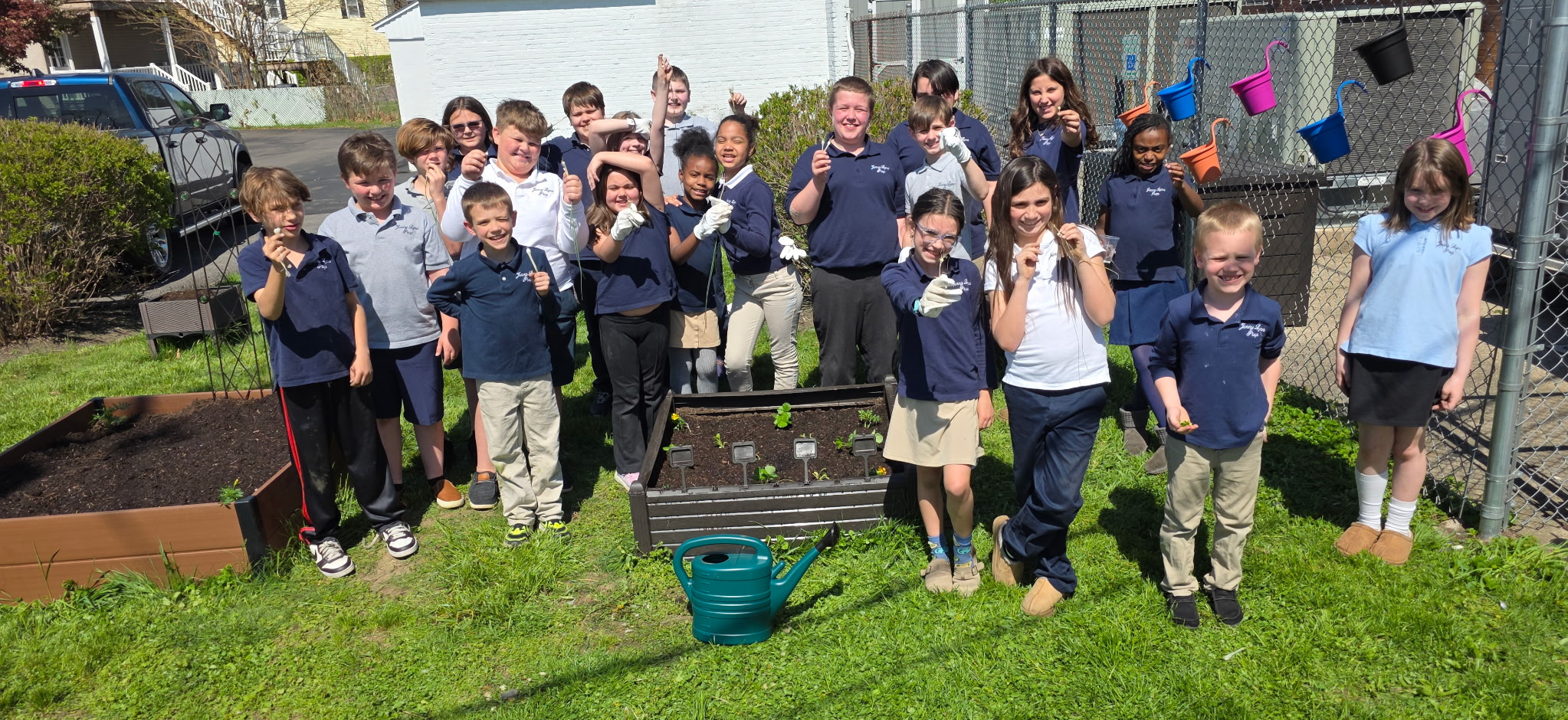 Jenny Lynn students work with Jayanne Czerniakowski on their school...