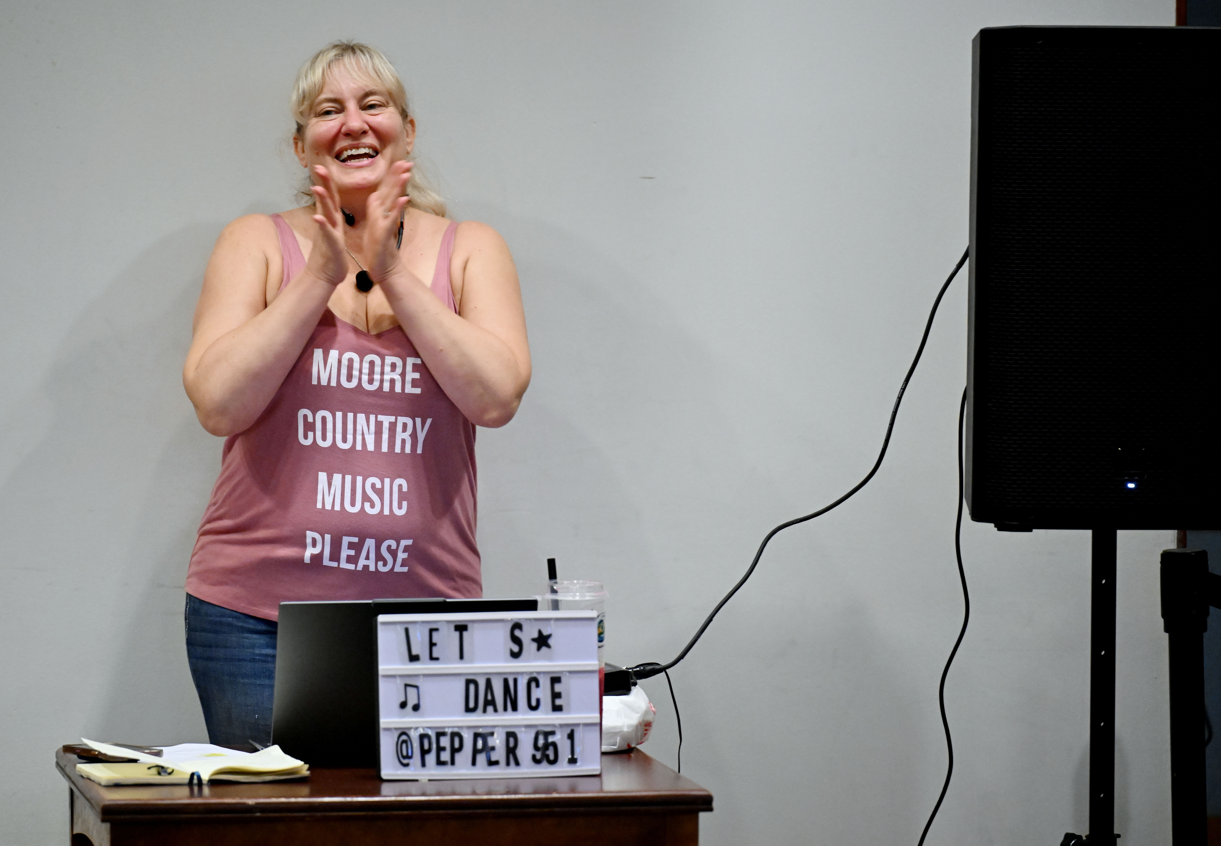 Pepper McDonel, center, teaches line dancing during Victoria Gardens Western...