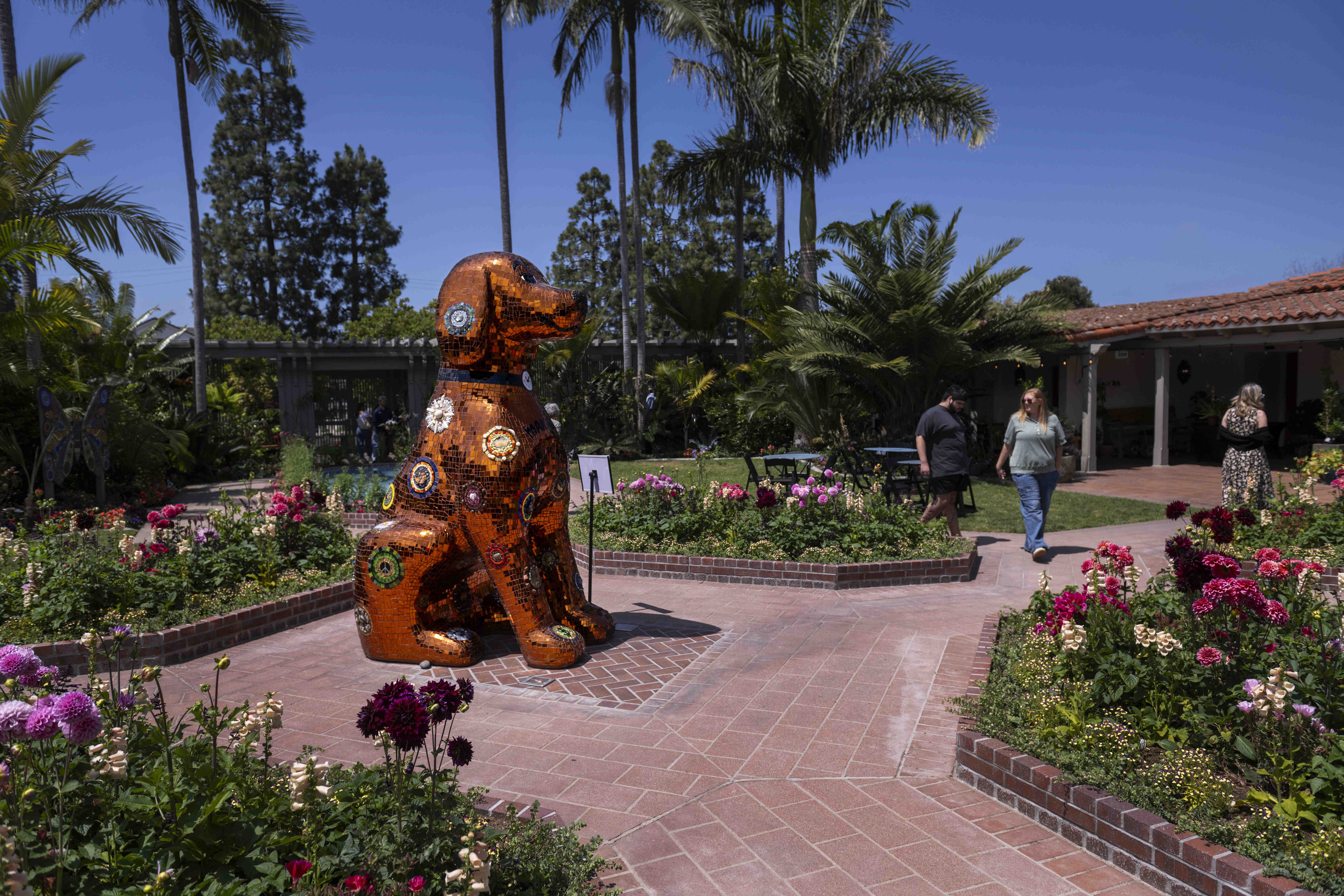 The mosaic dog sculpture Honey is the centerpiece of the...