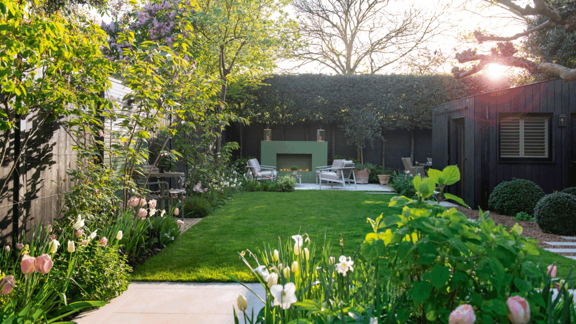 A new layout and clever zoning have transformed this urban garden a garden with a patio area and large green outdoor fireplace and seating in front