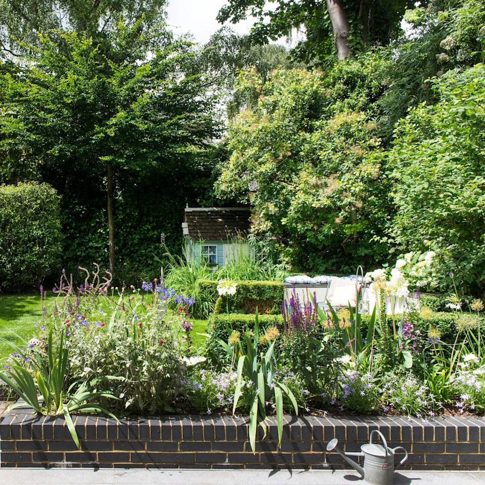 Flower bed border between patio and lawn
