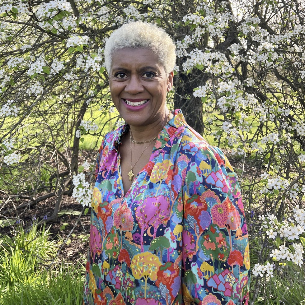 Arit Anderson arit anderson standing in front of flowering trees