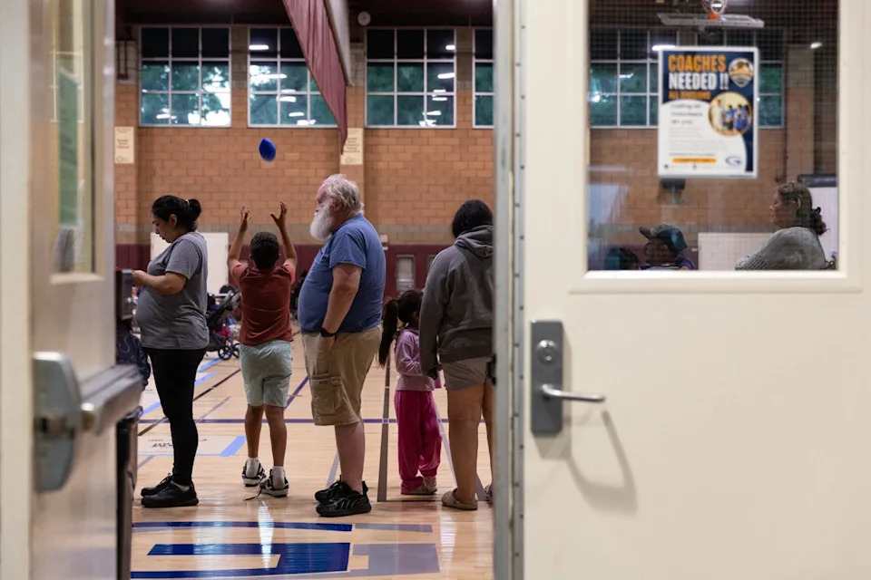 Evacuees wait in line for food after a chemical leak from a large storage tank threatened residents in Garden Grove, California on May 22. Nearly 50,000 people have been evacuated (AFP/Getty)