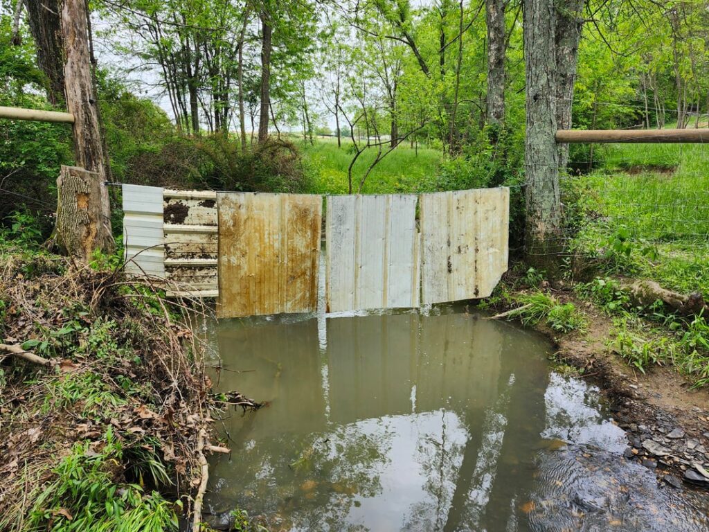 Fenced a small creek. Bedrock @30"