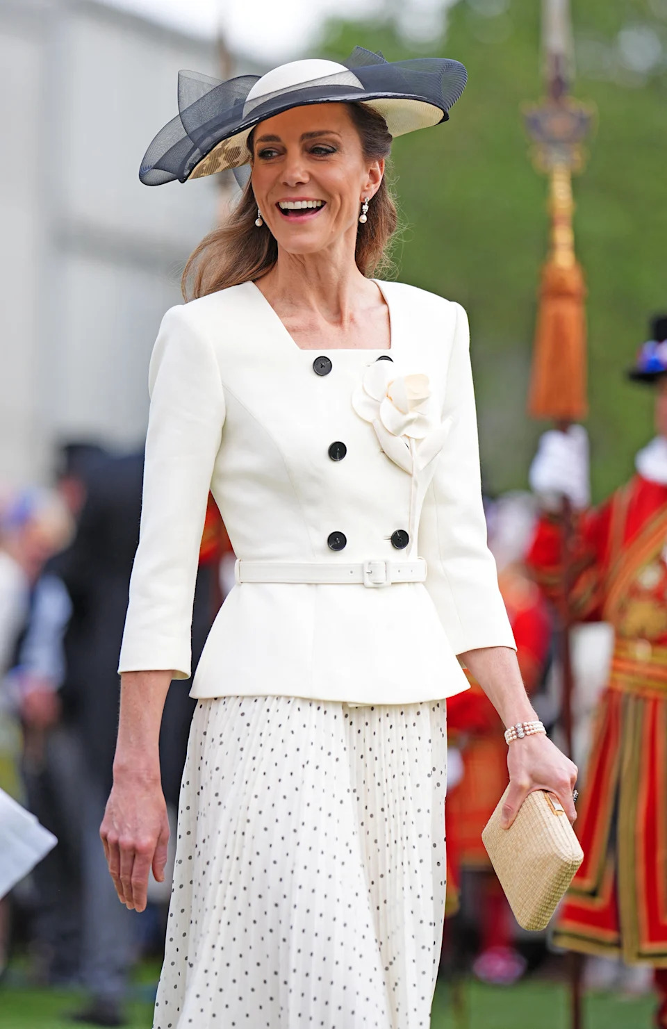 Catherine, Princess of Wales, talks to guests during a Royal Garden Party at Buckingham Palace in 2026. / Aaron Chown / Getty Images