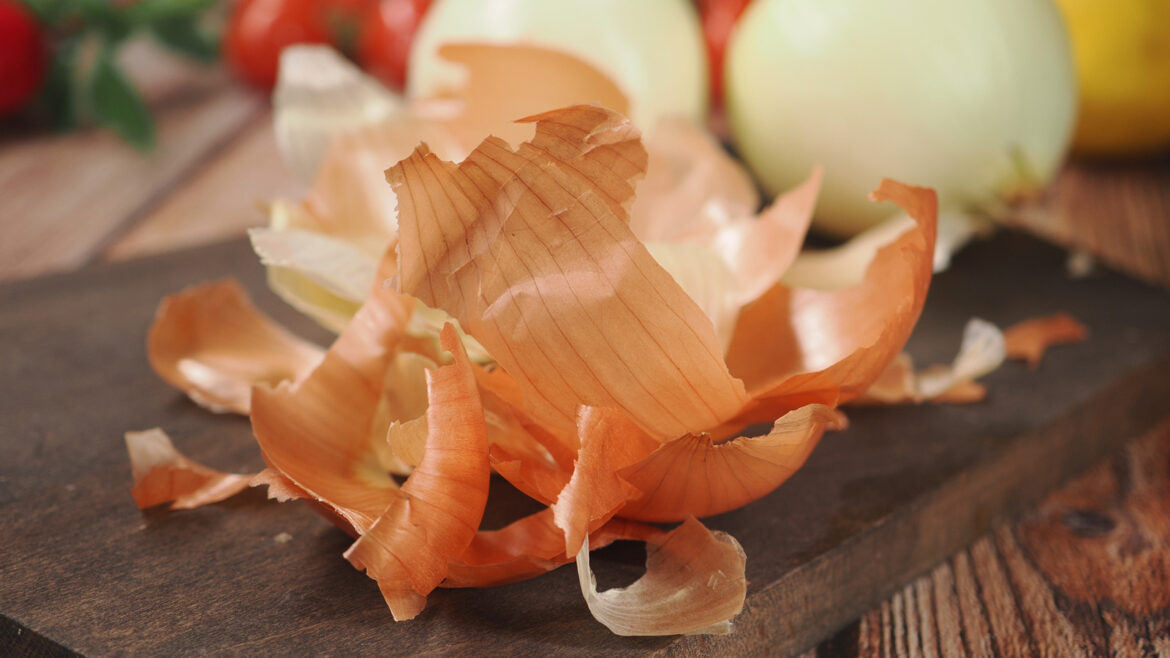 Don't Throw Away Onion Peels — They Belong In Your Garden
