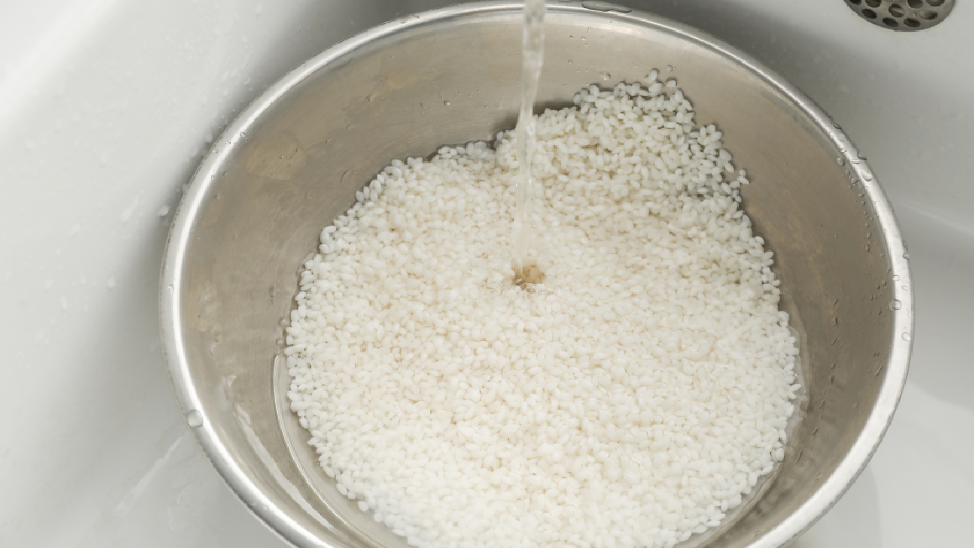 Water being poured on rice