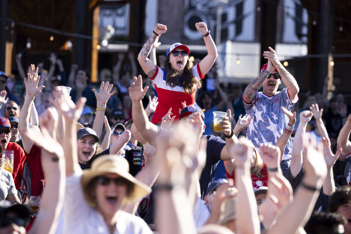 Hundreds watch the United States vs. Paraguay World Cup soccer game on a screen set up at Kulshan Trackside Beer Garden.